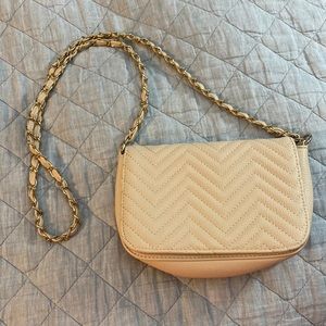Beige crossbody bag with gold accents